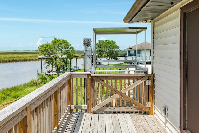 wooden deck featuring a water view