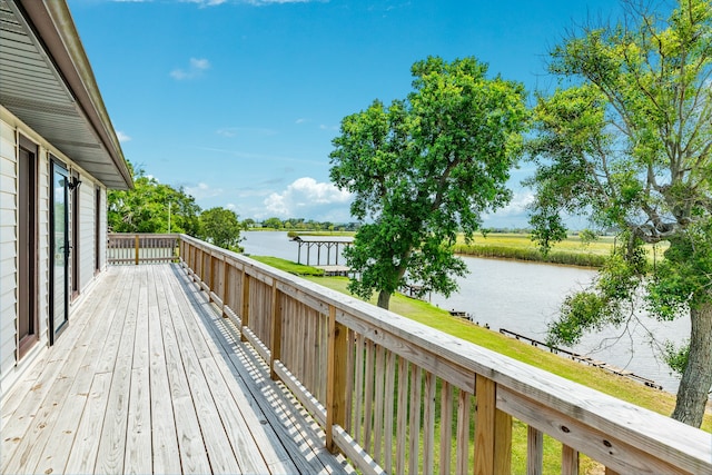 wooden deck featuring a water view