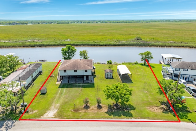 aerial view with a rural view and a water view