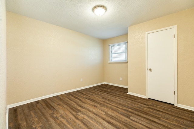 unfurnished bedroom with wood-type flooring and a textured ceiling