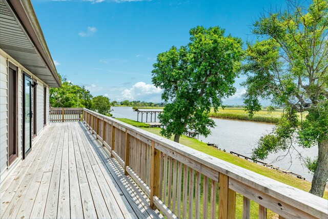 wooden terrace with a water view