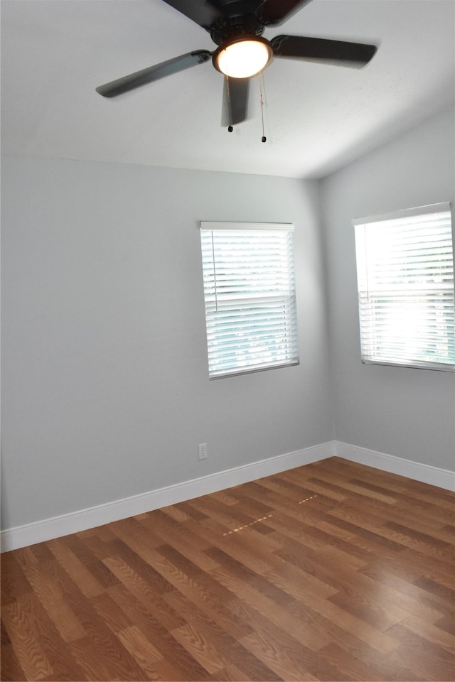 empty room with ceiling fan and wood-type flooring