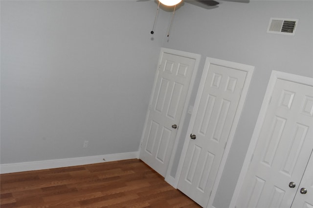 interior space with ceiling fan and hardwood / wood-style floors