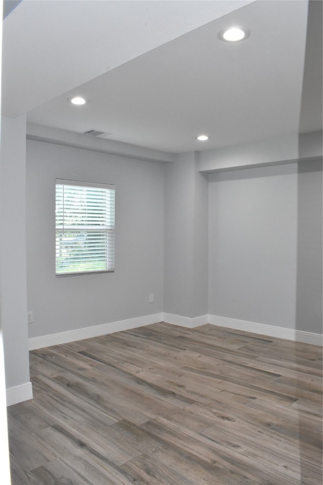 empty room with hardwood / wood-style floors