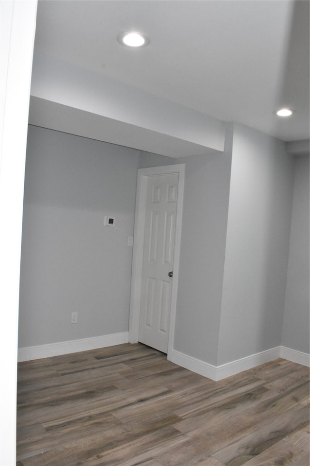 empty room with hardwood / wood-style flooring