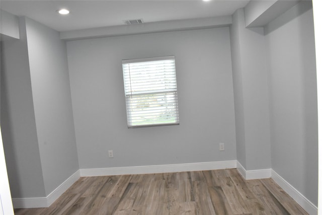 spare room with hardwood / wood-style flooring