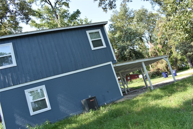 view of property exterior with a carport and cooling unit