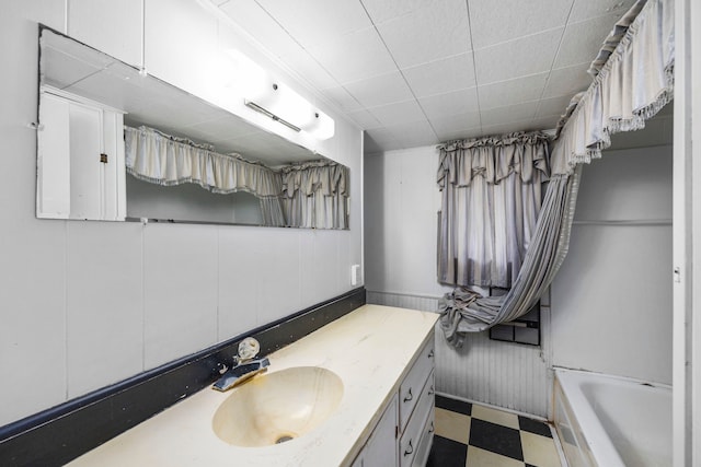 bathroom featuring vanity and a tub