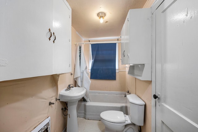 bathroom with tile patterned flooring, toilet, shower / bath combination, and baseboard heating