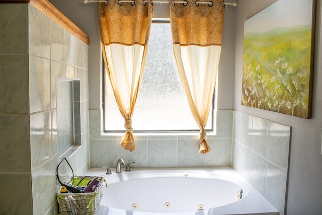 bathroom featuring a tub and tile walls