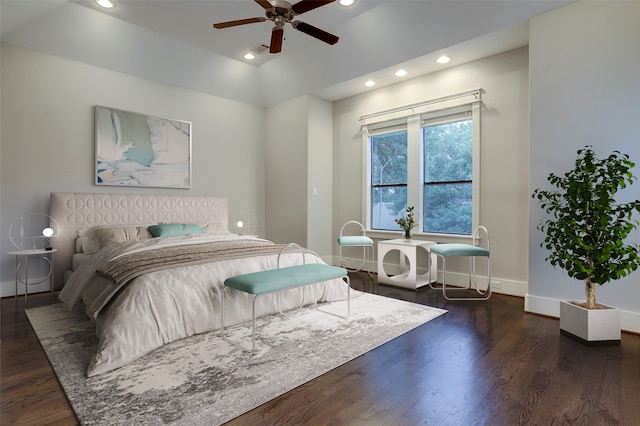 bedroom with ceiling fan and dark wood-type flooring