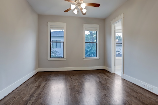 unfurnished room featuring ceiling fan and dark hardwood / wood-style floors