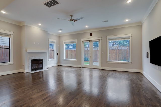 unfurnished living room featuring ceiling fan, dark hardwood / wood-style floors, and crown molding