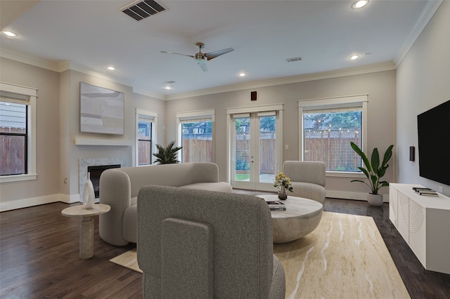 living room featuring ceiling fan, crown molding, dark hardwood / wood-style flooring, and french doors