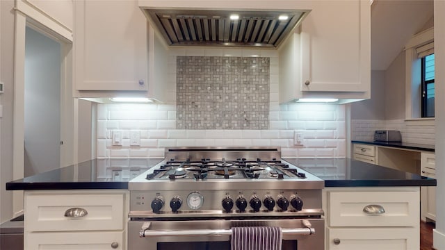 kitchen featuring backsplash, white cabinets, and double oven range