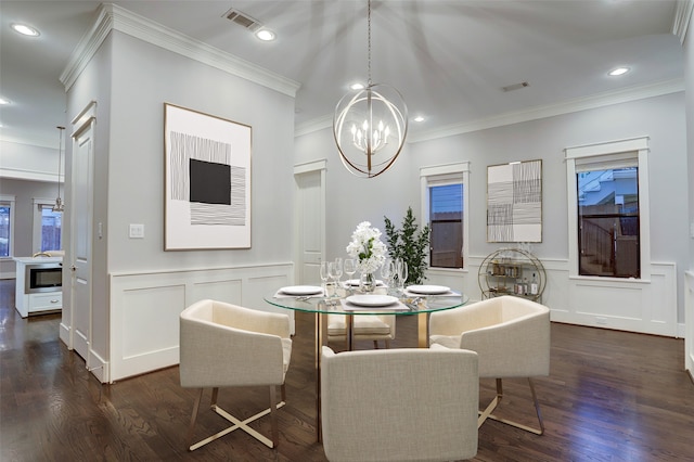 dining room featuring a notable chandelier, dark hardwood / wood-style floors, and crown molding