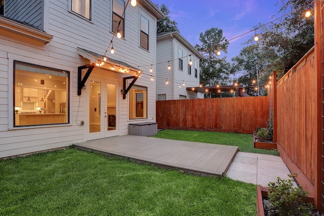 yard at dusk with a deck