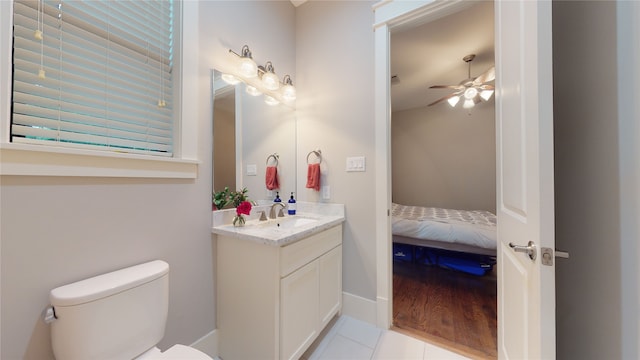 bathroom featuring ceiling fan, wood-type flooring, vanity, and toilet