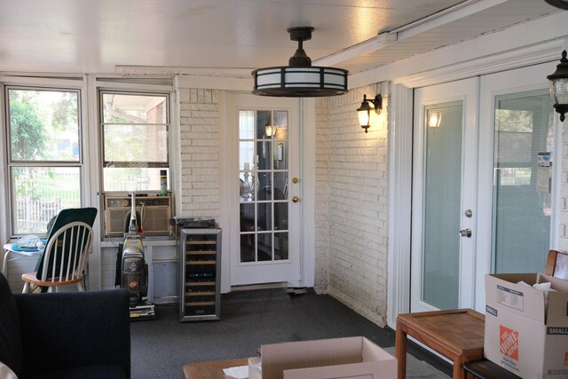 interior space featuring beverage cooler, french doors, and cooling unit