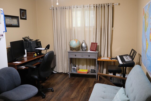 home office with dark hardwood / wood-style flooring