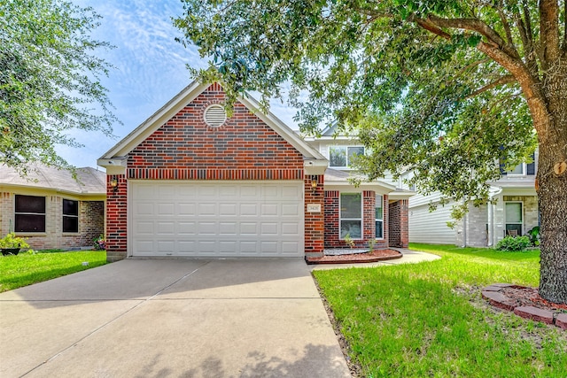 view of front of home featuring a garage and a front lawn