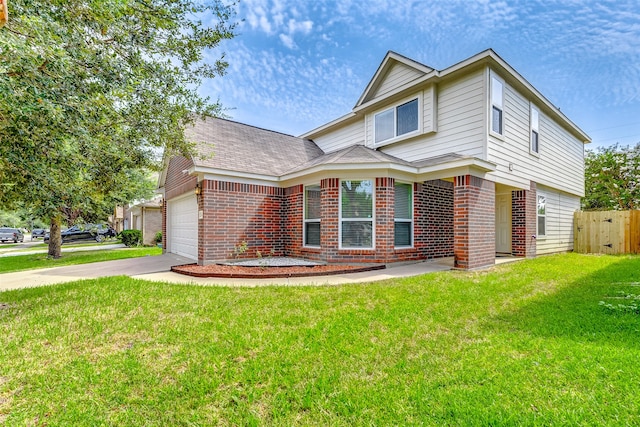 view of front of home featuring a garage and a front lawn