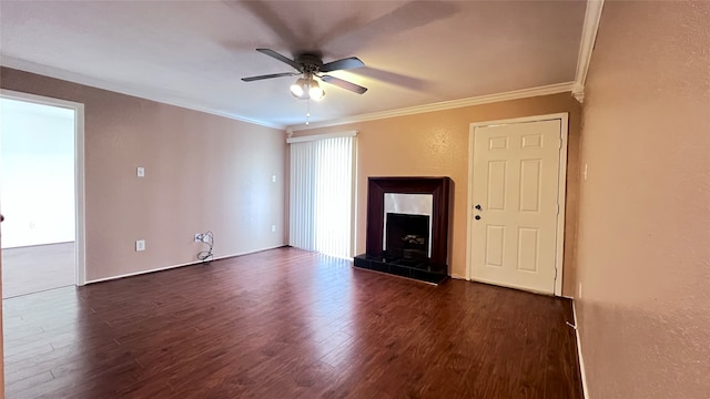 unfurnished living room featuring a tile fireplace, ornamental molding, dark hardwood / wood-style flooring, and ceiling fan