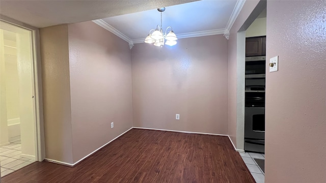 unfurnished dining area featuring light hardwood / wood-style flooring, a chandelier, and ornamental molding