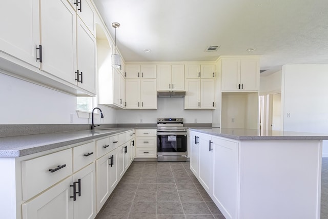 kitchen featuring hanging light fixtures, white cabinetry, and stainless steel electric range