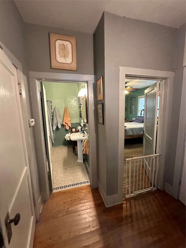 corridor featuring hardwood / wood-style floors