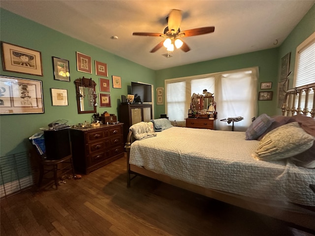 bedroom featuring ceiling fan and dark hardwood / wood-style flooring