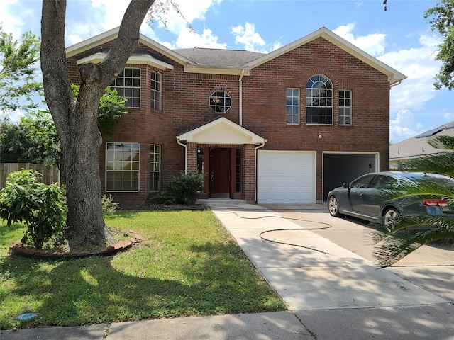 view of front of property featuring a garage and a front yard