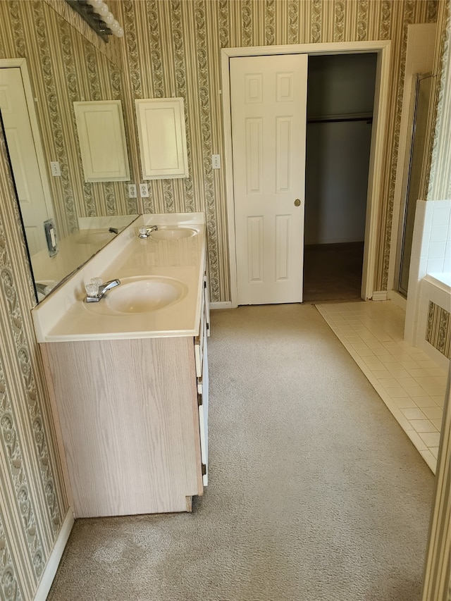 bathroom featuring dual vanity and tile patterned flooring