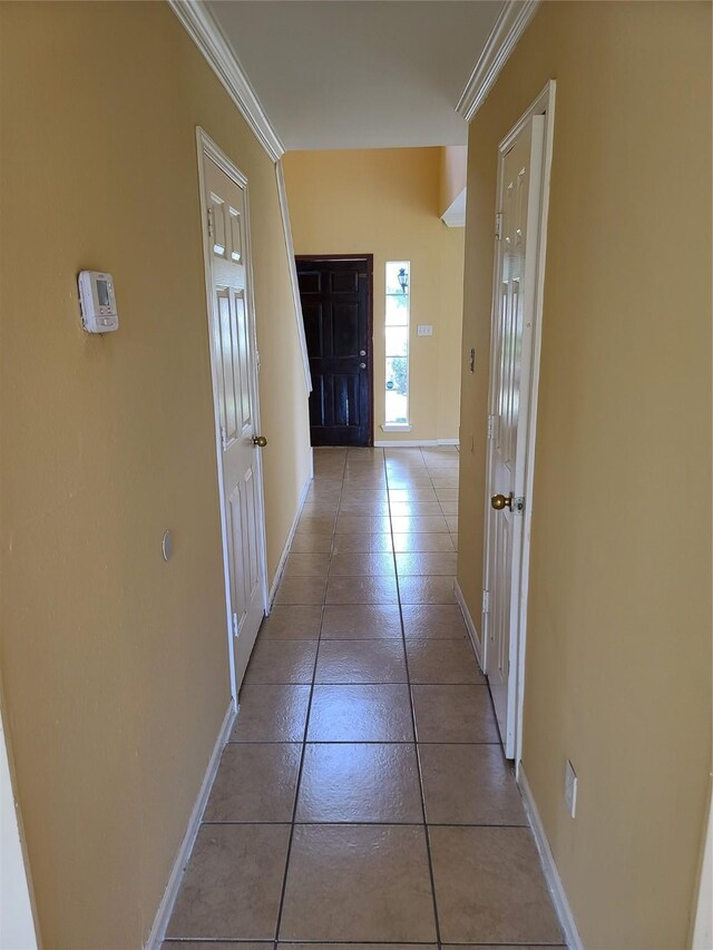 6403 Spring Crk, Houston, TX 77084 - corridor featuring light tile patterned floors and crown molding