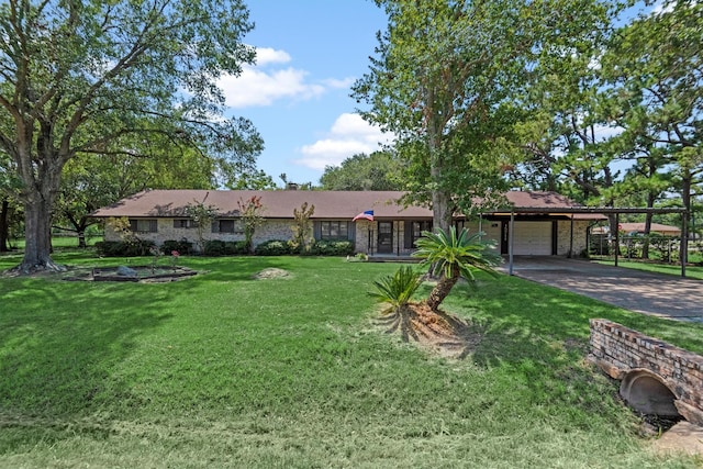 ranch-style house featuring a carport and a front yard