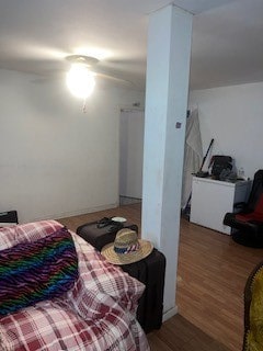 bedroom featuring ceiling fan and wood-type flooring