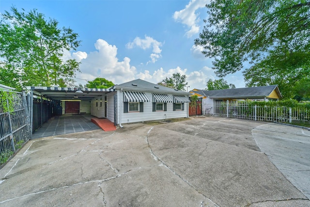 rear view of house featuring a carport