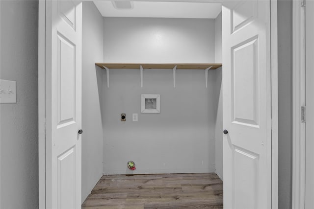 washroom with washer hookup, electric dryer hookup, and light hardwood / wood-style floors