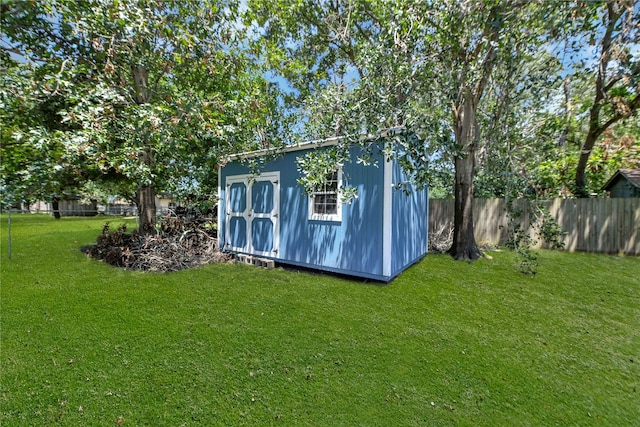 view of outbuilding with a lawn