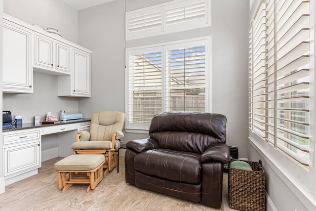 sitting room featuring built in desk