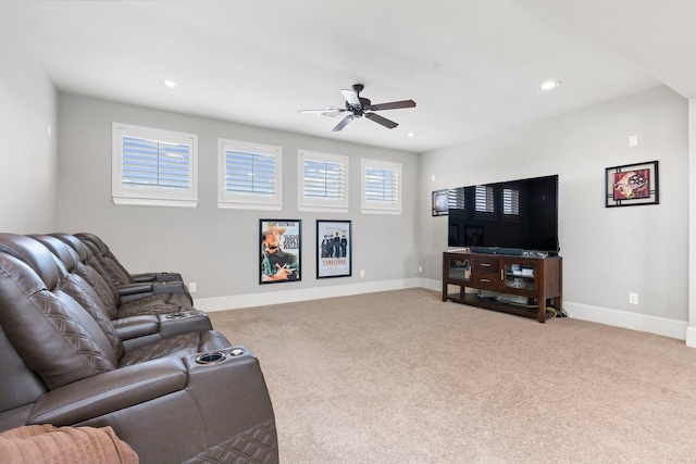 carpeted living room featuring ceiling fan