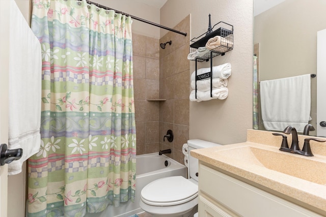 full bathroom featuring shower / bath combo, vanity, and toilet