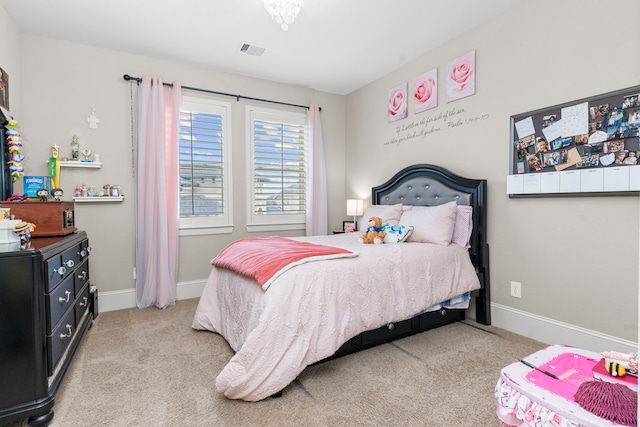 bedroom featuring light colored carpet