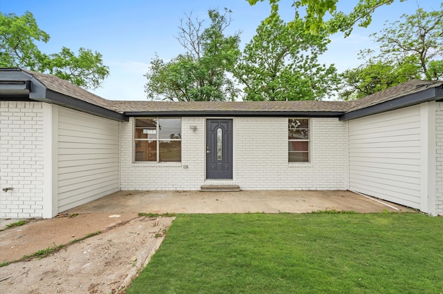 exterior space featuring a lawn and a patio