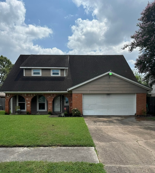 view of front facade featuring a front lawn and a garage