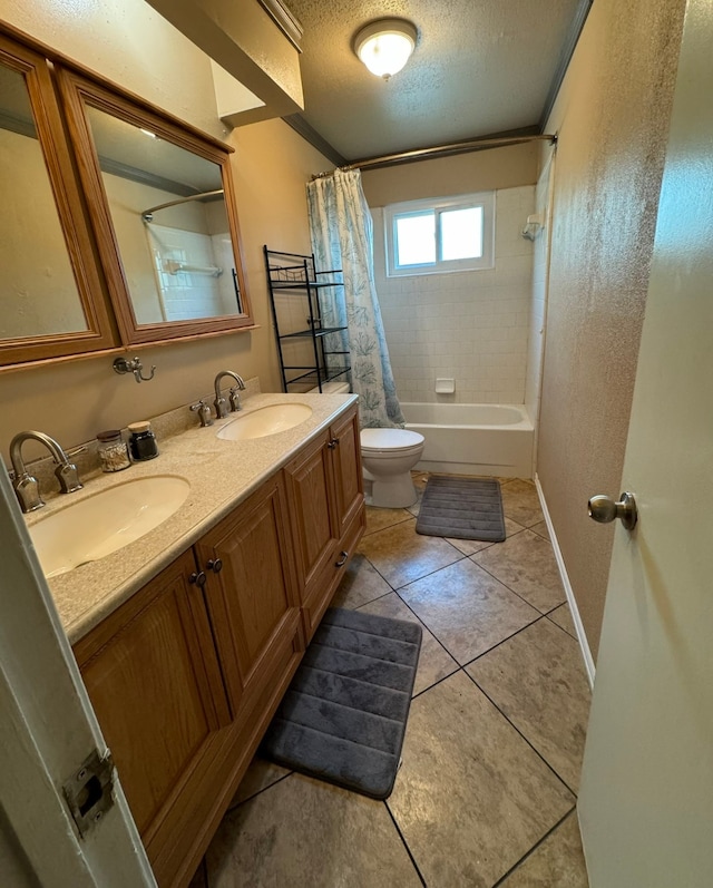 full bathroom with a textured ceiling, shower / bath combo with shower curtain, toilet, tile patterned floors, and dual vanity