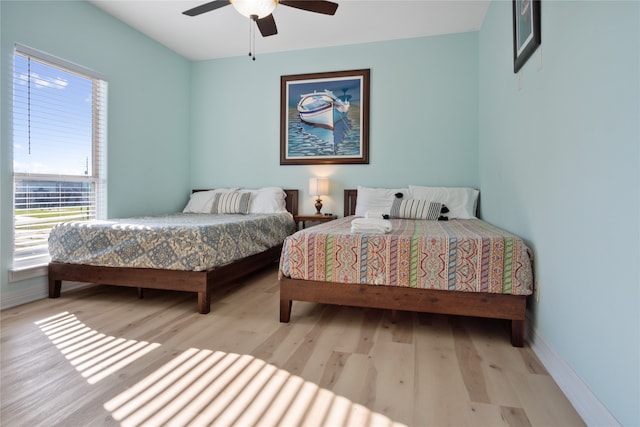 bedroom featuring ceiling fan and light hardwood / wood-style floors