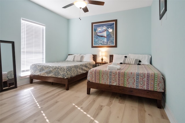 bedroom featuring ceiling fan and light hardwood / wood-style floors