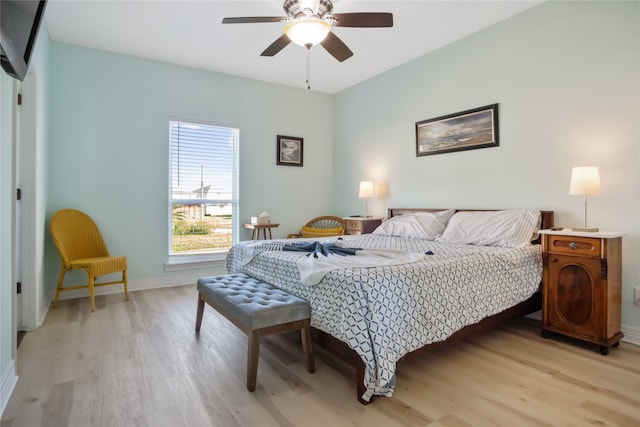 bedroom with ceiling fan and light hardwood / wood-style floors