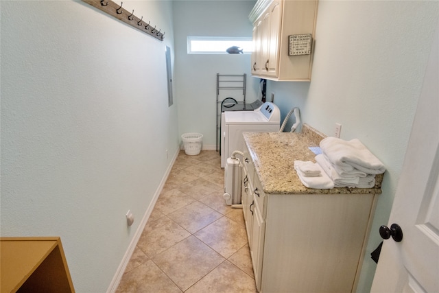 bathroom with washing machine and dryer and tile patterned floors